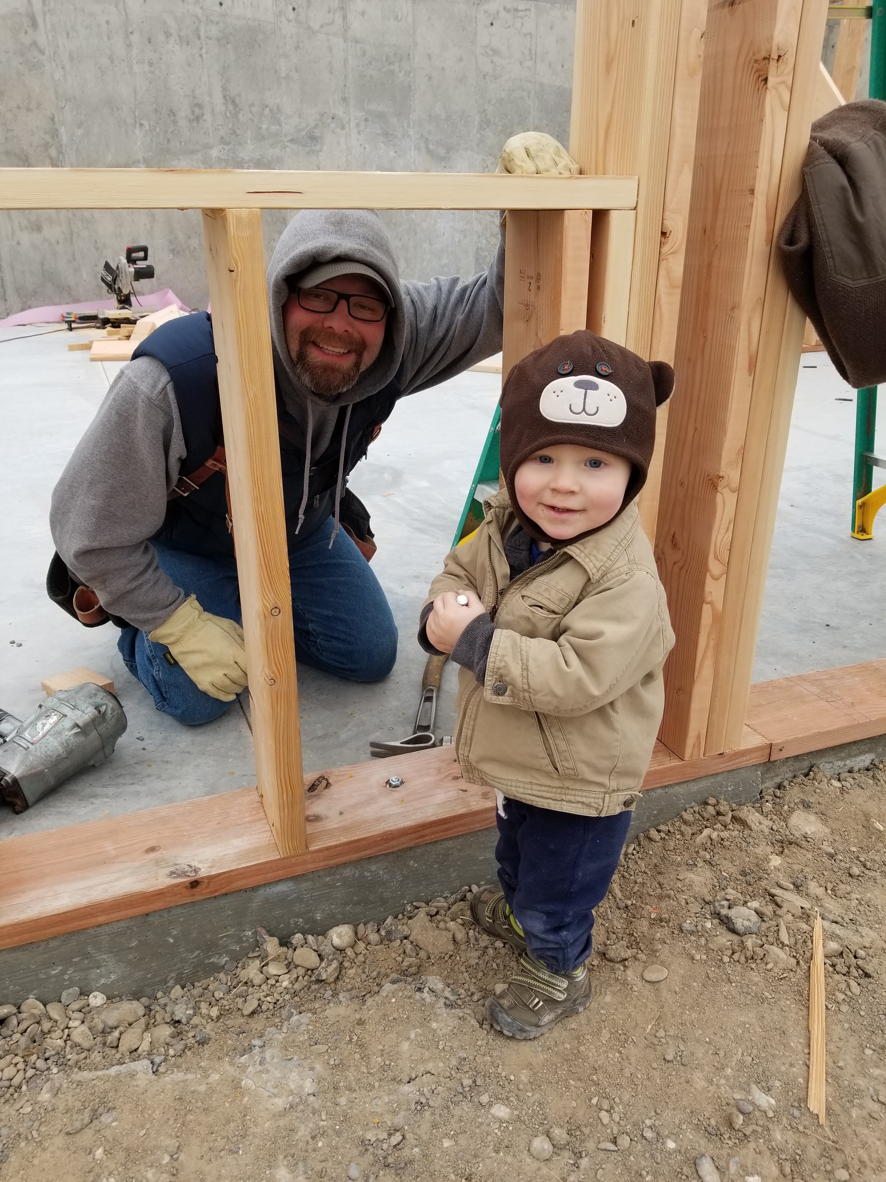 Todd and his son on the job site
